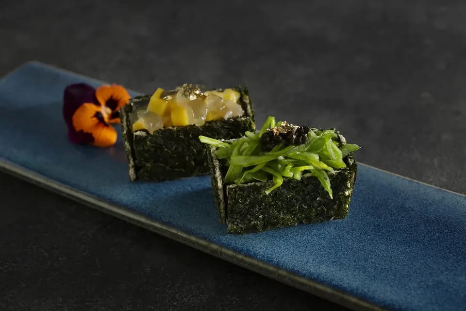 Nori-wrapped bites topped with mango, aloe and fresh greens