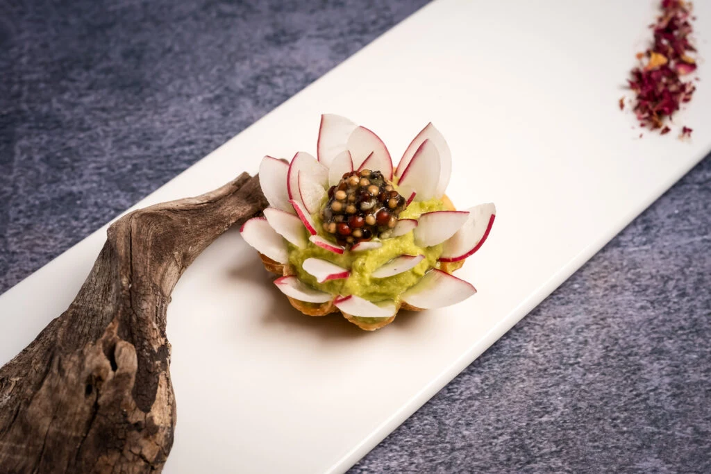 An artistic vegetable presentation on a white plate at Taste of Beauty