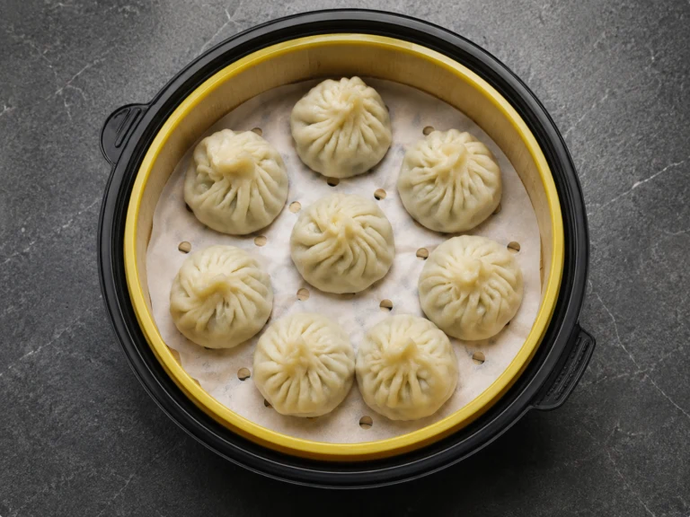 An overhead view of Taste of Beauty xiaolongbao arranged in a steamer